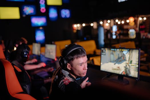 Young adults engaged in competitive gaming at an atmospheric cybercafe, sharing the esports experience.